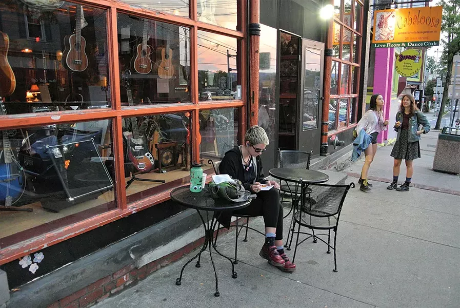 Colleen Rogers, Jade Mogavero and Lily Lavender Wolf in front of Root Note Music and Cafeteria Coffee House. - JOHN GARAY