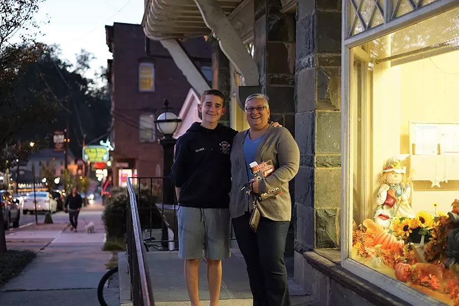 Daniel and Jo Ann Goswick in front of Grinnell Library in Wappingers Falls. - JOHN GARAY