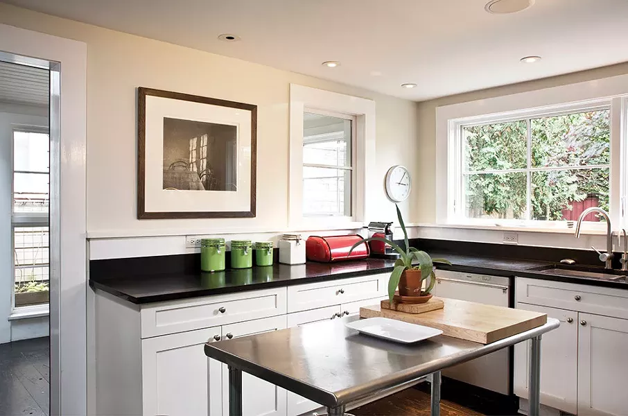 With the historic facade preserved, Smith was free to remake the back of the home, maximizing both light and views. The space flows graciously from historic front to contemporary rear, and easily between indoor and outdoor spaces. - DEBORAH DEGRAFFENREID