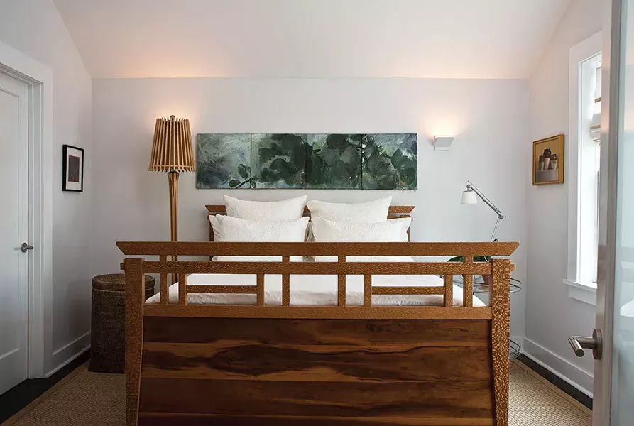 While Smith didn’t add actual space to the home’s second floor, she was able to add spaciousness. Smith is inspired, in part, by Japanese architecture where a simple, contextual aesthetic predominates design. “The negative space is almost more important than what you fill a room with,” she explains. The bed was designed by her brother, Dave Smith, of Ingrain Furniture in Seattle. - DEBORAH DEGRAFFENREID