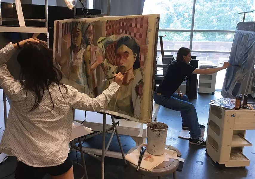 Yan Lam Ko painting at the 2017 Summer Art Institute.