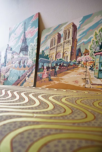The home’s decor is influenced by Callan’s time in France. Paint by number pictures of Parisian street scenes line one wall. - DEBORAH DEGRAFFENREID