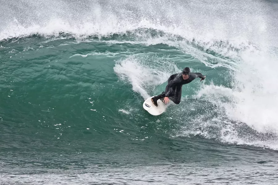 Winter surfing at Morro Rock, California; courtesy of Flickr - MIKE BAIRD