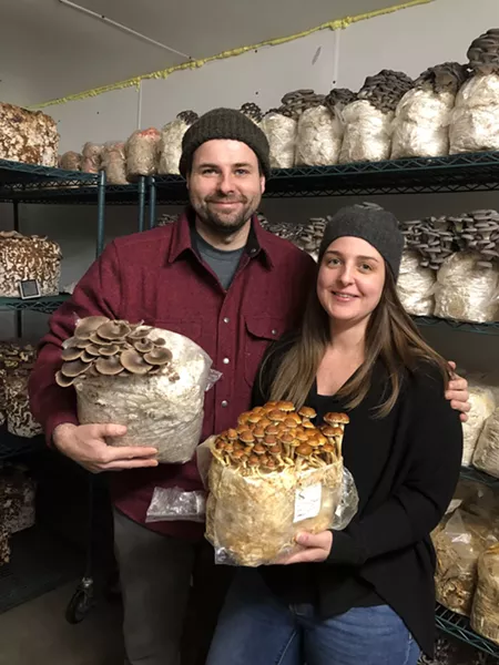 Grace and Devon with their mushrooms.