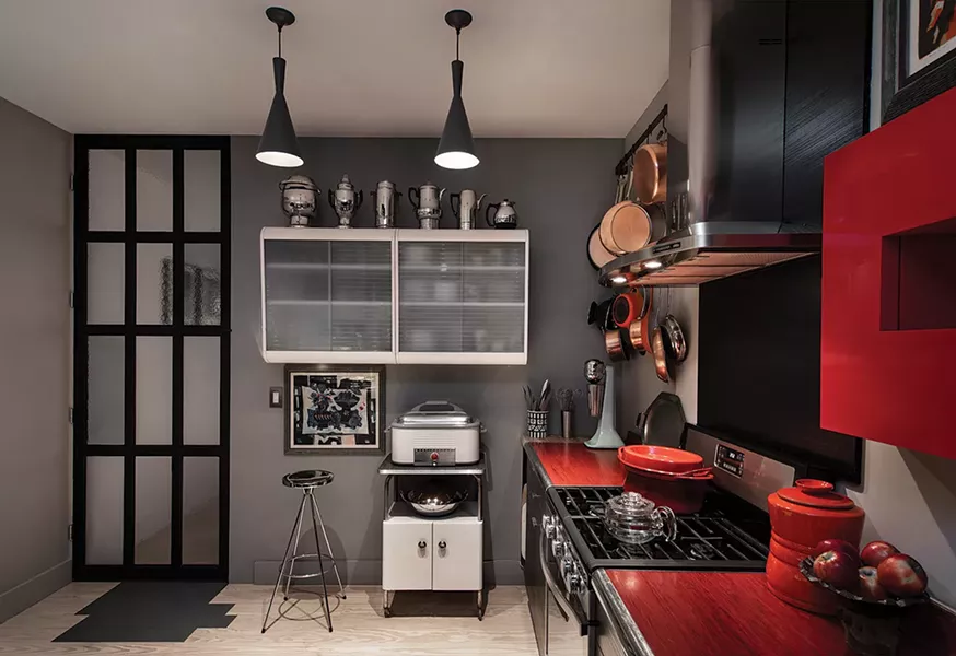“Aunt Linda’s” kitchen cabinets surrounded by some of Gillette’s favorite vintage kitchen equipment and topped with a few coffee pots. - DEBORAH DEGRAFFENREID