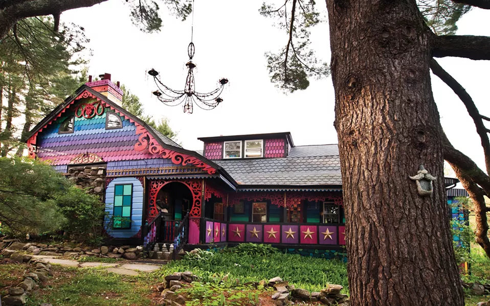 Friends helped paint the house's colorful exterior. O'Sullivan never plans her designs: "I always just know what color should come next," she says. - DEBORAH DEGRAFFENREID