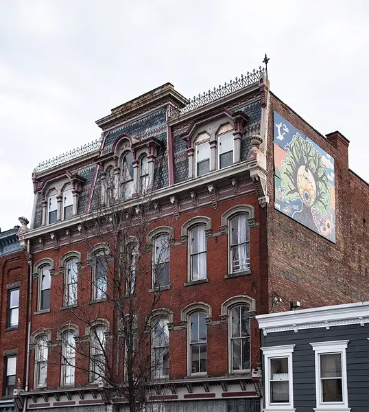 Bickman’s loft occupies the top three floors of a former Odd Fellows Temple. Bickman’s mural Timeless Saugerties compliments the building’s 19th century gothic facade. Bickman painted the piece with 9 local young people during the summer of 2017 as part of her Mural Arts Program. - PHOTO BY DEBORAH DEGRAFFENREID