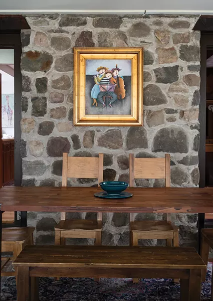 When she first visited the home she immediately knew the downstairs vaulted great room would be the perfect space to write. “It’s got perfect light and a nice view of the trees, but the view isn’t too distracting,” she explains. She added a large wooden table to the space, where she’s written and organized parts of her two non-fiction books. - PHOTO: DEBORAH DEGRAFFENREID