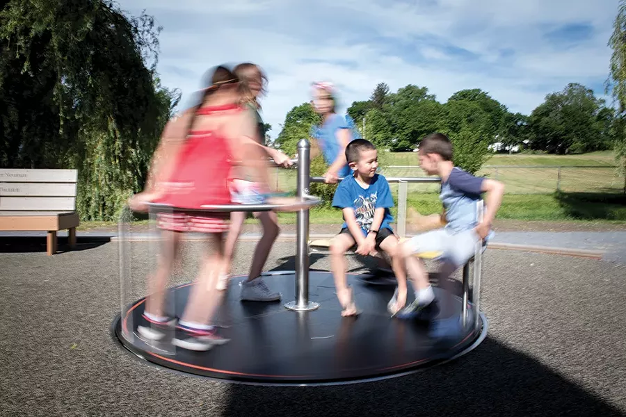Luke Cirillo (in focus) and friends at Stanley-Demming Park playground, where ADA park construction has begun. - PHOTO: CHRISTINE ASHBURN