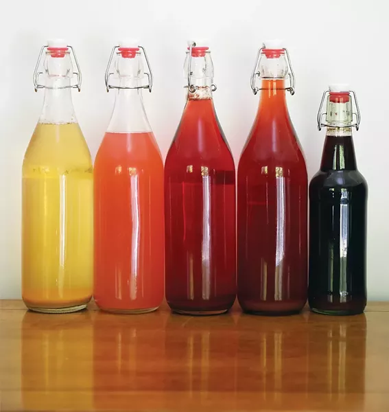 Taste the rainbow. Meads from left to right: peach, rose-rhubarb, grape, black currant, elderberry-yarrow. - PHOTO: PETER BARRETT