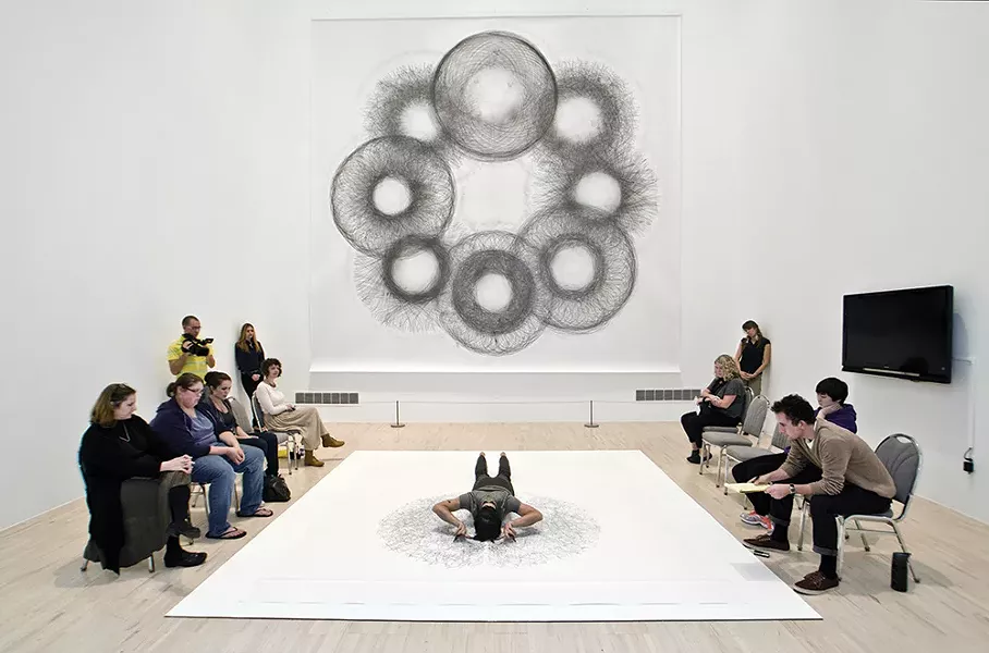 Tony Orrico creating a Penwald Drawing, part of a series of bilateral drawings exploring the use of the body as a tool of measurement to inscribe geometries through movement. - PHOTO COURTESY OF THE HUDSON EYE FESTIVAL