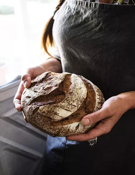Hammer made the sourdough bread (as well as her ring) from scratch. The chance to create handmade meals, and encourage more thoughtful consumption, was part of what brought them to the Hudson Valley. “We wanted a better day-to-day quality of life, an opportunity to grow our own food and be better stewards of the Earth,” says Lafferty. With guest meals, the couple try “to lace in an awareness of humane consumption, having grown more conscientious of the finite resources on this planet.” - PHOTO: DEBORAH DEGRAFFENREID
