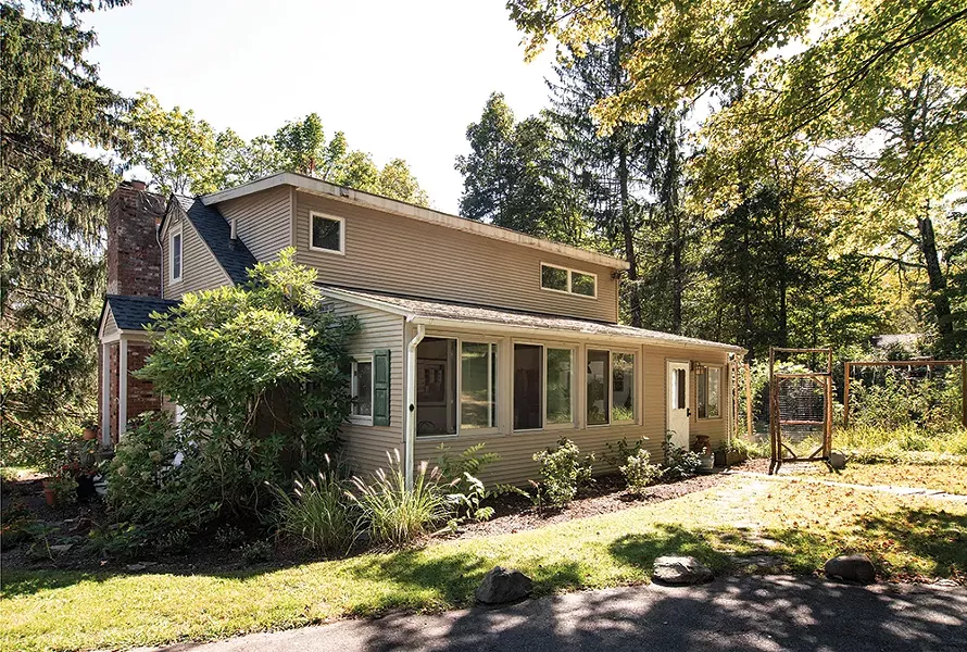 When they bought the 1946 Cape Cod in 2018, it included vestiges of a large perennial garden planted in the 1970s. The couple have been working to bring it back to life, as well as planting - an heirloom vegetable garden to supply their guests’ meals. - PHOTO: DEBORAH DEGRAFFENREID