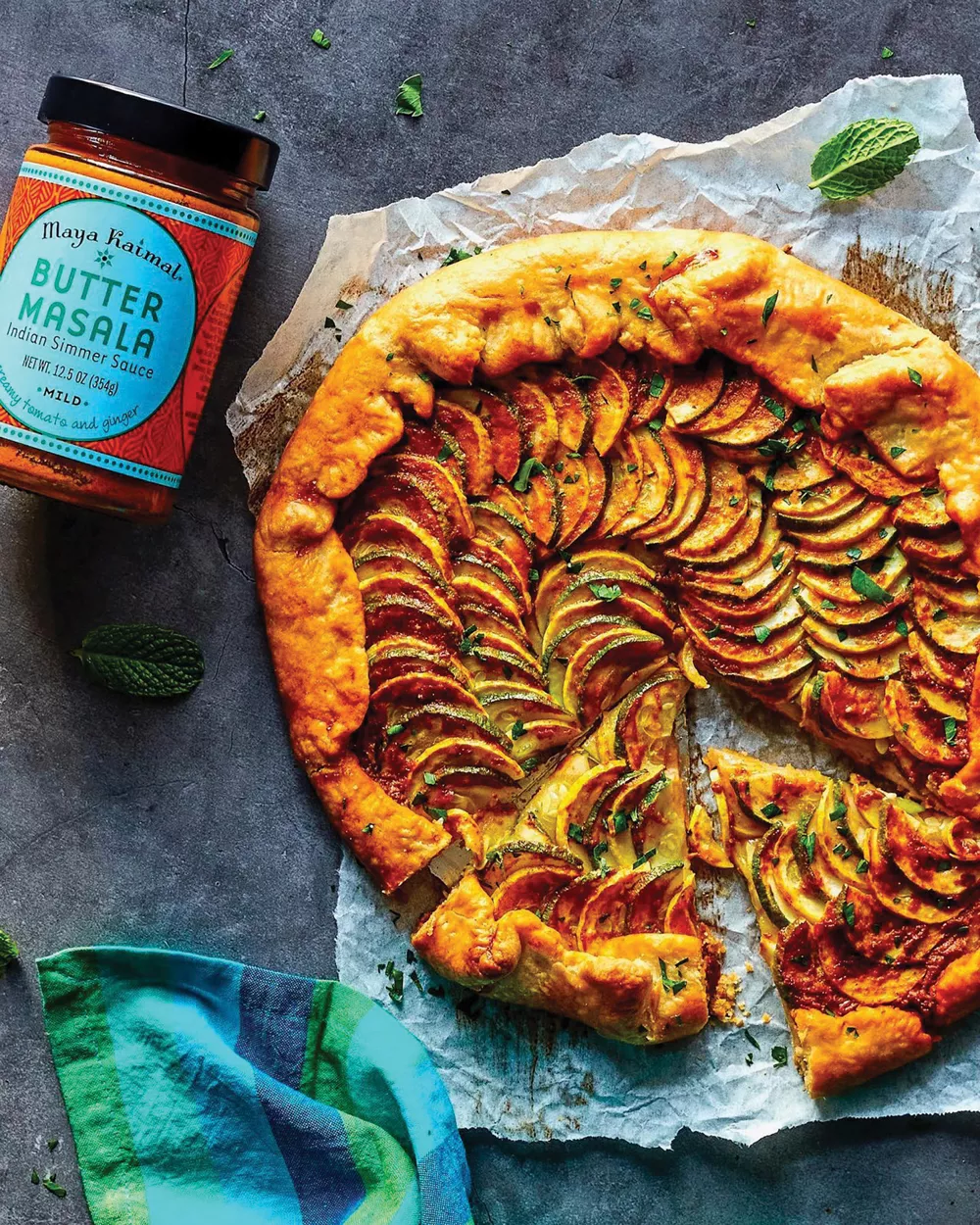 Masala Squash Galette: Flaky pastry topped with seasonal squash, fresh herbs, and Maya Kaimal’s Butter Masala.