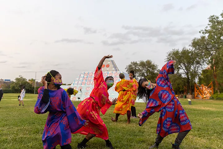 Performance in front of "Because Once You Enter My House It Becomes Our House" at Socrates Sculpture Park, 2020.