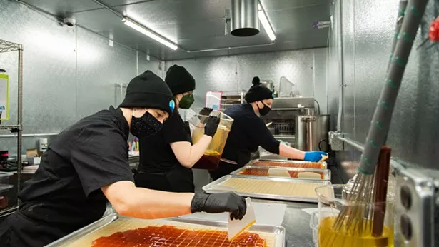 The Pass's Marijuana-Infused Products team making gummies. - IMAGE COURTESY OF THE PASS