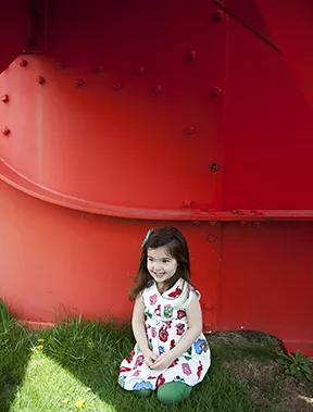 A 3-year-old enjoys the shade of "Gui (Mistletoe)" an Alexander Calder sculpture from 1976 at the Storm King Art Center - HILLARY HARVEY