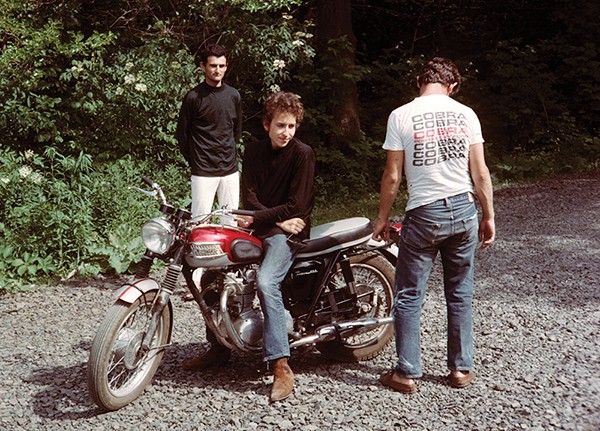 Bob Dylan on his Triumph Bonneville with Victor Maymudes (left) and Bobby Neuwirth, Bearsville, summer 1964 - JOHN BYRNE COOKE