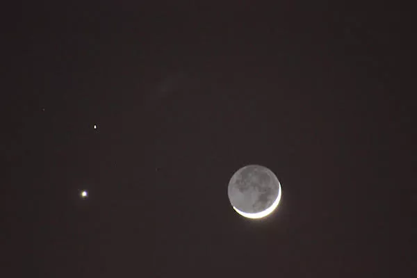 The February 2015 conjunction of Venus and Mars, with a crescent Moon mimicking this week’s Full Moon via what’s called “Earthshine.” - PHOTO BY AMANDA PAINTER.