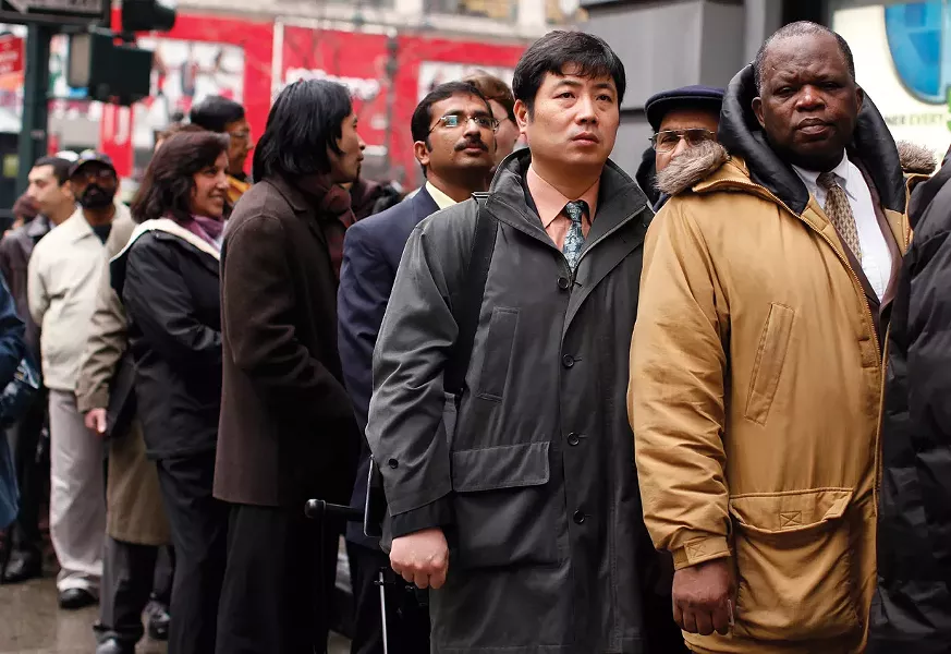 Unemployed workers wait in line to enter the NYCHires Job Fair in New York, on December 9, 2009. unemployment insurance is part of what Tea Party activists like Rep. Paul Ryan of Wisconson have decried as the “culture of dependency” that current government policies perpetuate, threatening to “smother the economy” and corrode our “national character.” - REUTERS / SHANNON STAPLETON