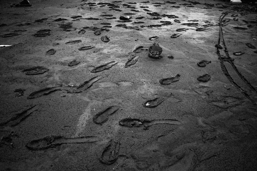 Workers footsteps in caked mud outside a destroyed factory in Sendai, Japan. - COURTESY OF FOVEA