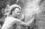 A bored Chuck partakes in some desert-island - graffiti.