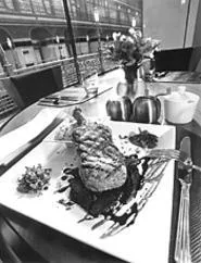 A juicy grilled pork-chop entrée competes with the Arcade for "best view" - status at 1890. - WALTER NOVAK