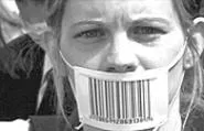 A protester, gagged and bar-coded.