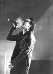 Bono butters up the crowd at Gund Arena. - WALTER NOVAK