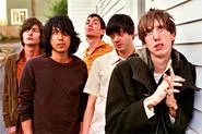 Bradford Cox (far right) is pure rock and roll. He gobbles pills and dresses like a girl.