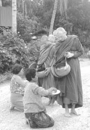 Buddhist monks receive alms.