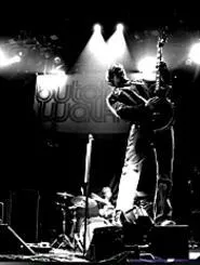 Butch Walker strikes a rock-and-roll pose onstage, moments before the 1970s asked for its sign back.