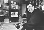 Cleveland Second City's Michael Bloom, shown here in "The Womb," his natural habitat, with his son, William.