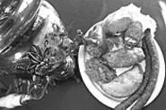 Comfort food, Russki-style: Cabbage rolls, stuffed - pepper, pelmeni, and sausage. - WALTER NOVAK