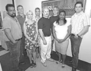 Dan Copfer (fifth from left) has an eye for detail that - could convict you or get you off. - WALTER NOVAK