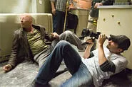 Director Len Wiseman frames Bruce Willis in Live Free or Die Hard.