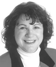 Editor Jan Leach's job is to hold her downtrodden - staff together.