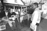Elwood Clark (right), on his world tour of Ward 7. - WALTER NOVAK