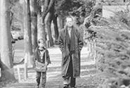 Haley Joel Osment with Bruce Willis in a scene from The Sixth Sense.
