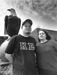 Hawks and eagles: Ashbrook scholars Dan Tierney - and Beth Vanderkooi, with campus mascot Old Abe. - WALTER NOVAK