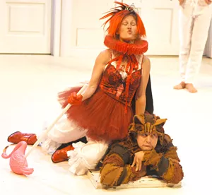 Heather Lea Anderson Boll's Queen of Hearts silences Nick Koesters' Cheshire Cat.