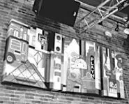 Hector Vega's jazzy Cleveland skyline is one of Bar - Flyy's works by local artists. - WANDA SANTOS-BRAY