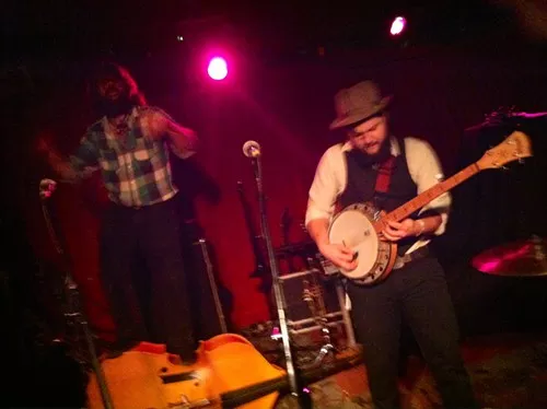 Jeshua Marshall stands on his bass, while Andrew Carew shreds the banjo. Jeshua Marshall stands on his bass, while Andrew Carew shreds the banjo.