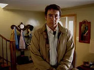 John Cusack as Stanley Phillips in James C. Strouse's Grace Is Gone.