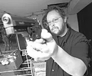 John Sahady's basement shooting range keeps him - going between club meetings. - WALTER NOVAK