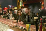 Joseph Gordon-Levitt and Matthew Goode busily plotting bank heists over a beer or two.