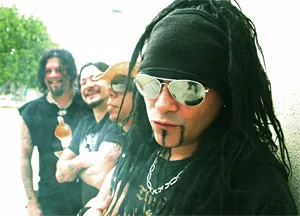 Jourgensen cracks up his bandmates with his "You can call me Al" joke.