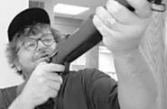 Moore takes aim at U.S. gun culture, but doesn't always hit his targets.