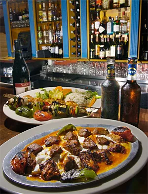 No turkey here: Char-grilled lamb nestles in mounded yogurt and tomato-butter sauce. - WALTER NOVAK