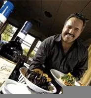 Owner Raphael Vaccaro shows off his standout Duxbury mussels and grilled salmon. - WALTER NOVAK